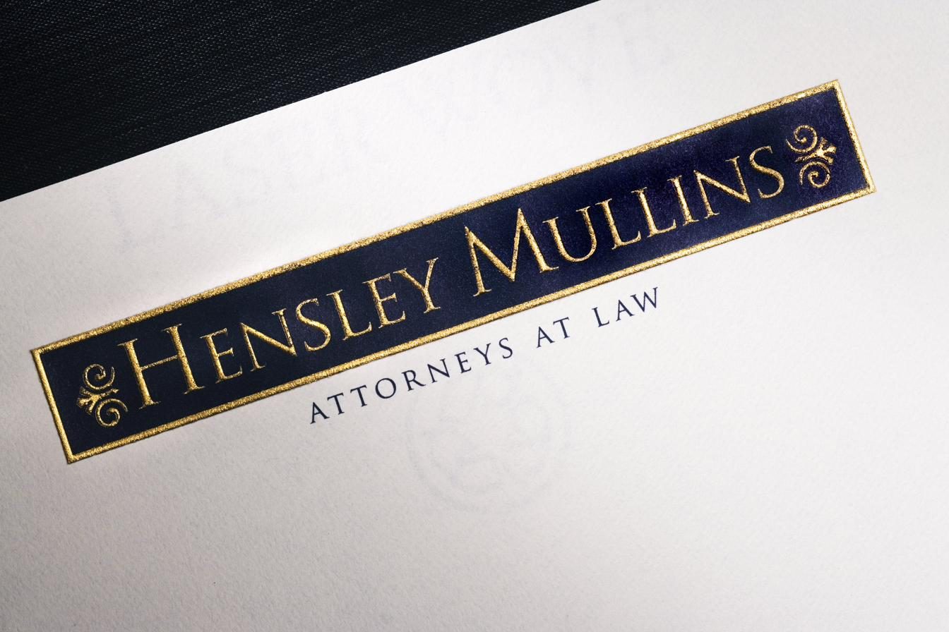 Gold and blue engraved over a watermark.