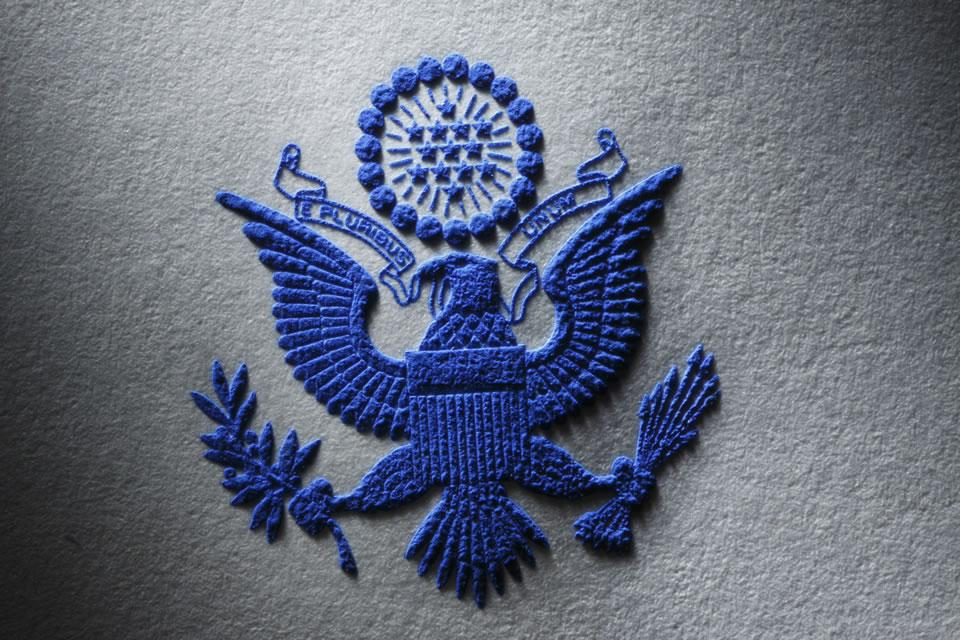 Engraved in blue on white textured stock.