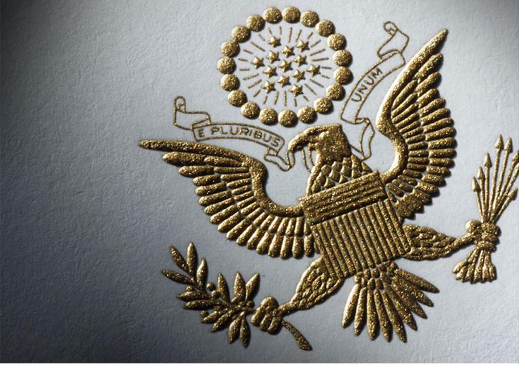 An engraved and embossed gold eagle, multiple in-house techniques on one piece.
