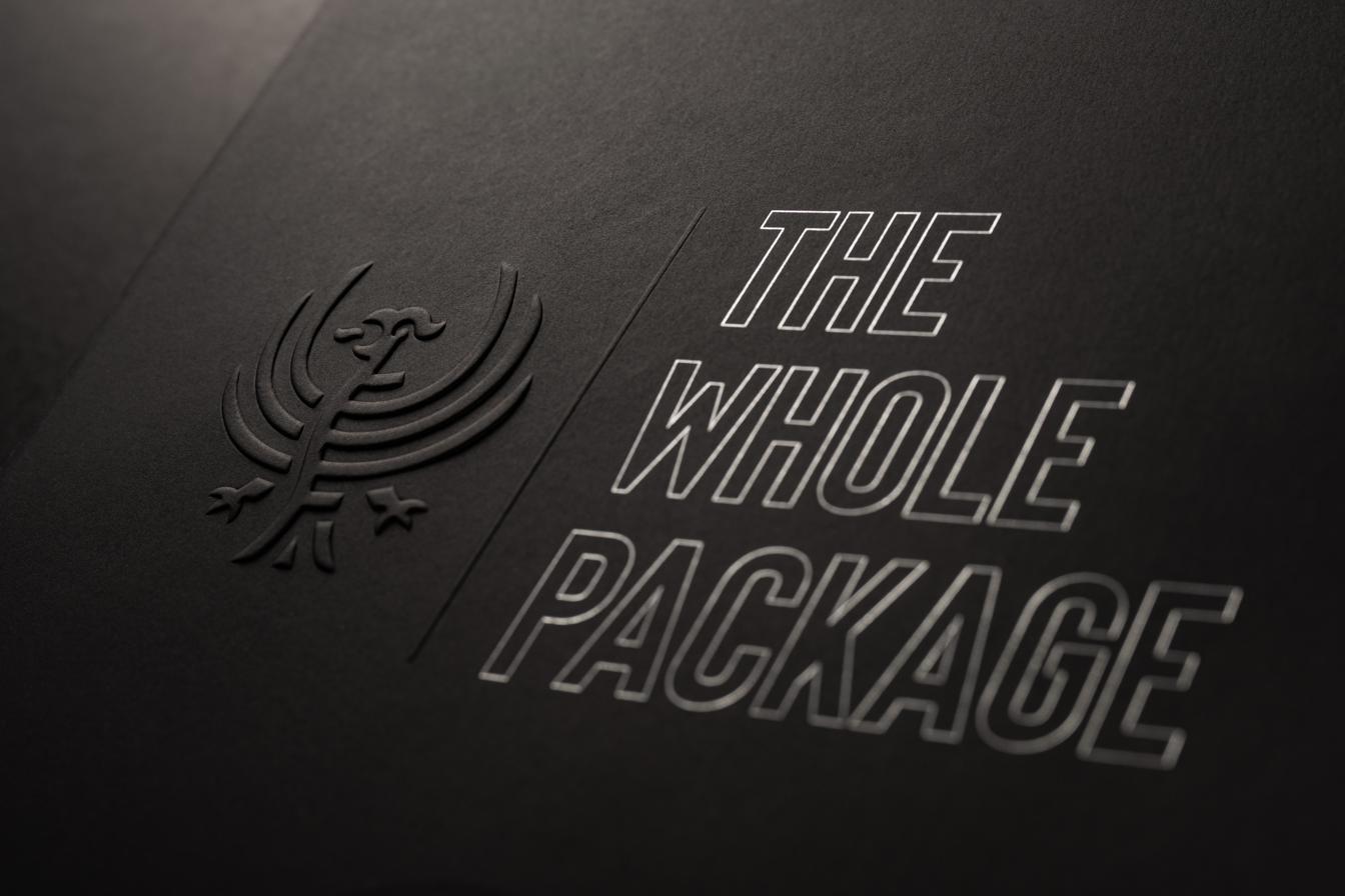 Emboss with spot gloss — a macro detail from the Nice Package samples.
